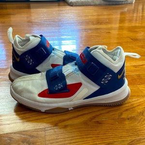 white blue gold red nike lebrons size 7Y (youth), worn in/ still good condition